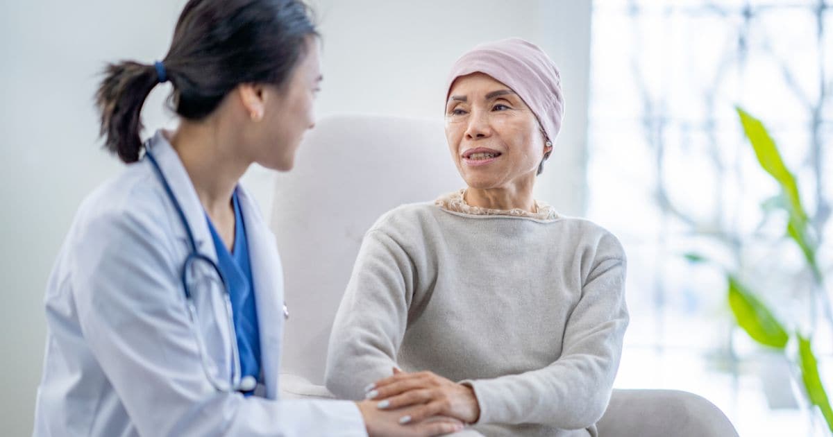 health professional with cancer patient