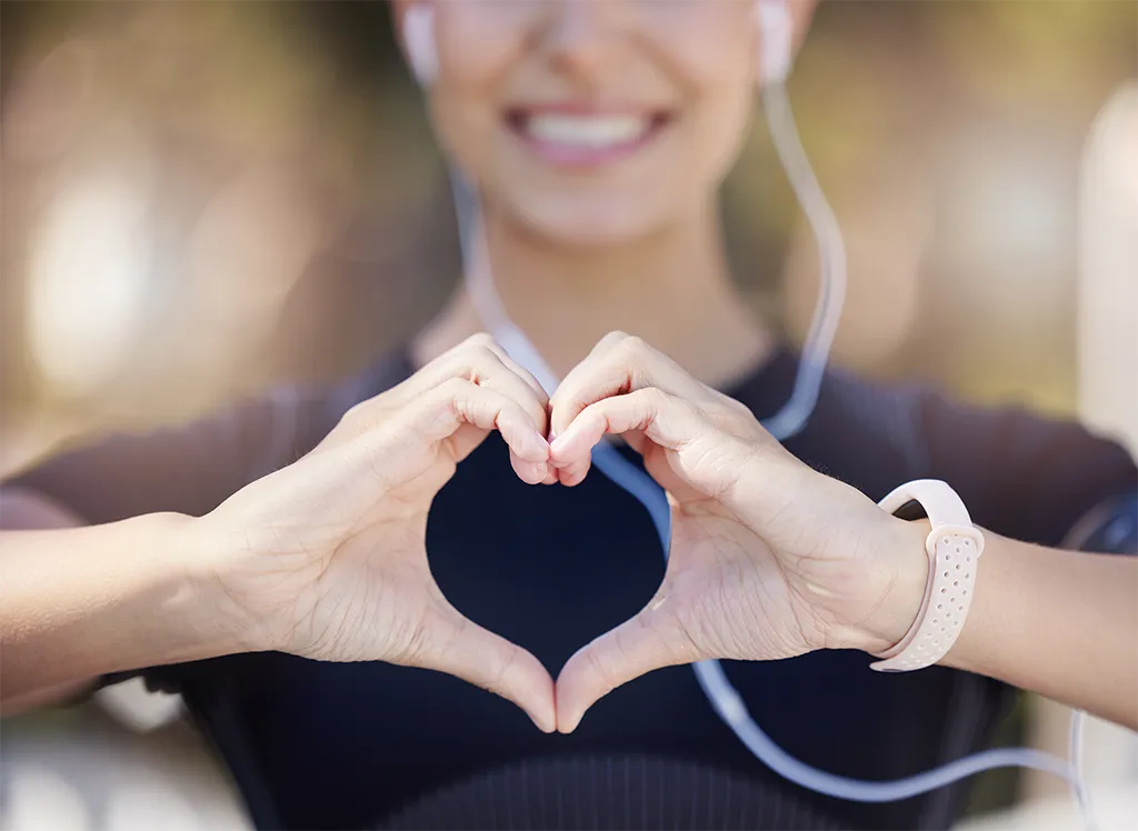 Female making a heart symbol with her hands