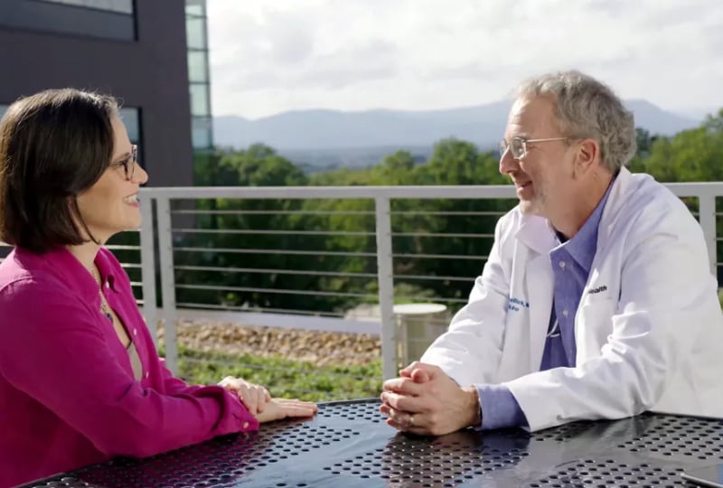 doctor and patient talking outside