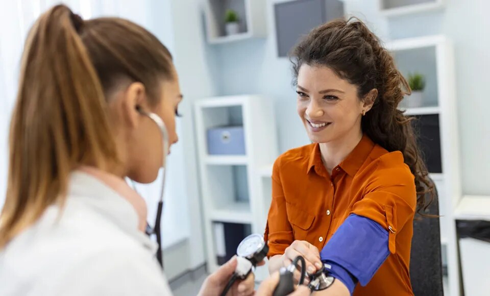 woman getting blood pressure check