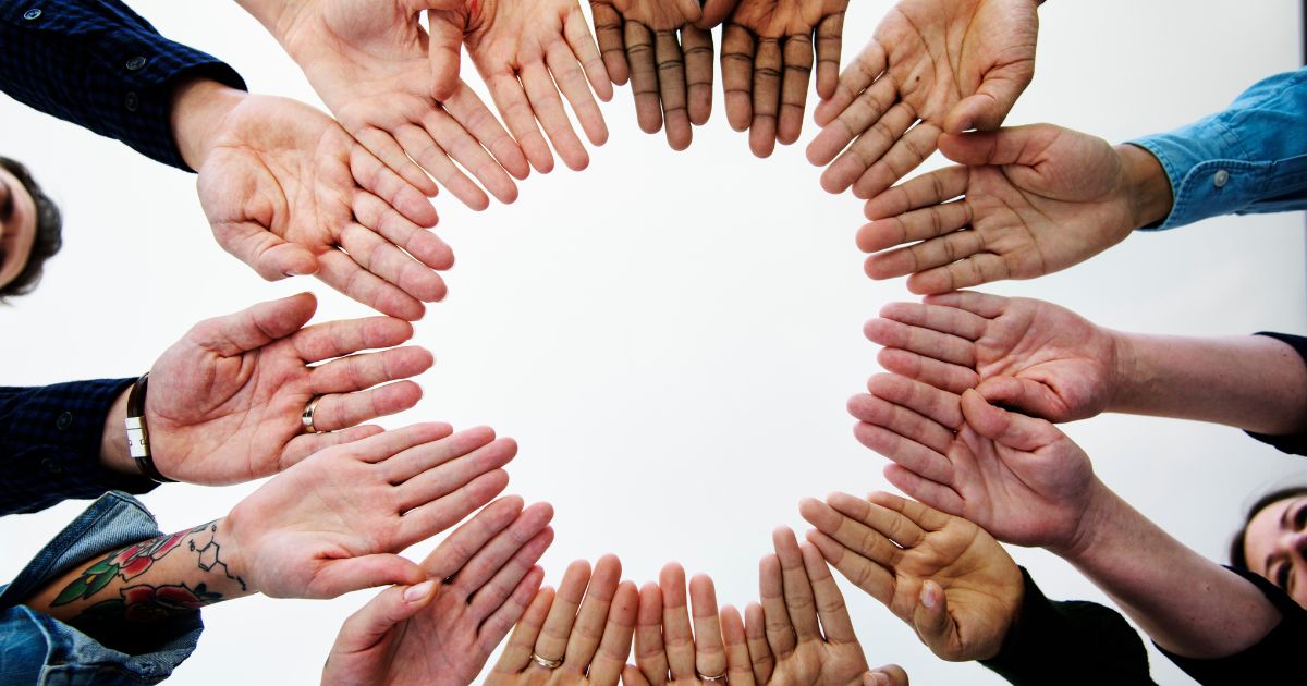 Hands in circle in collaboration