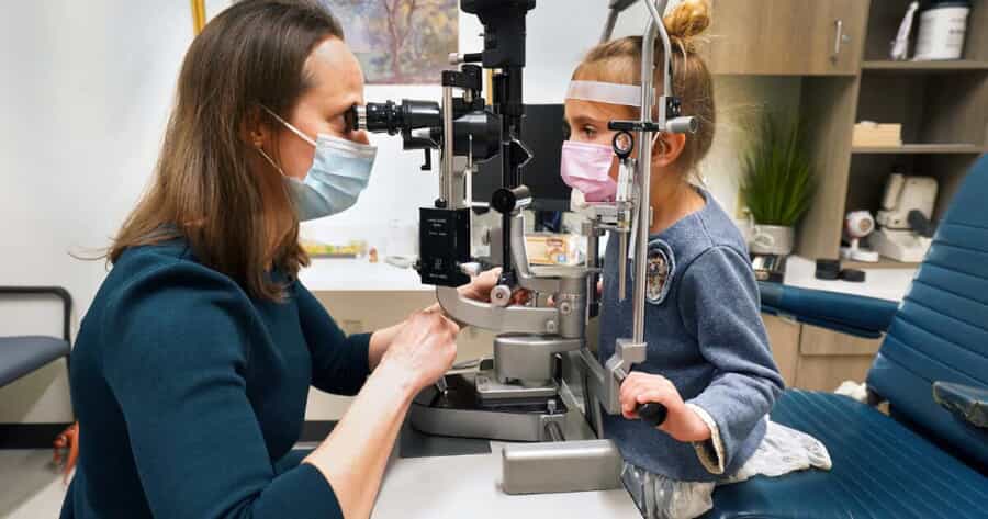 Dr. Seager examining girl