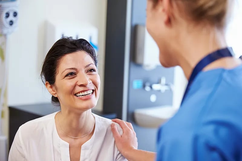 Female doctor talking to female patient