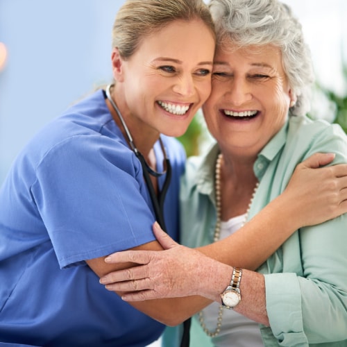 nurse and patient hugging