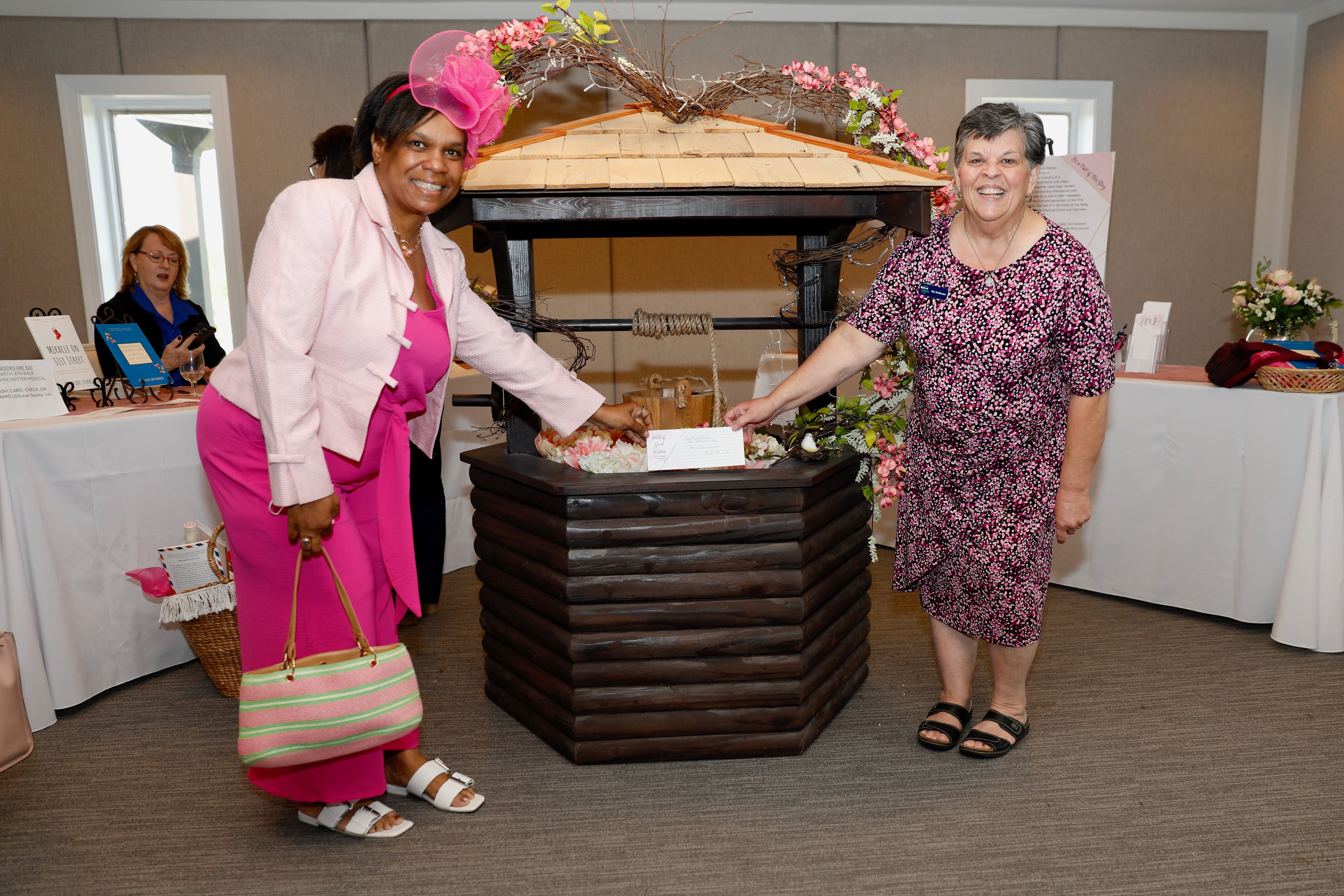 Picture of two women next to new wishing well