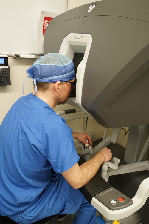 surgeon using robot