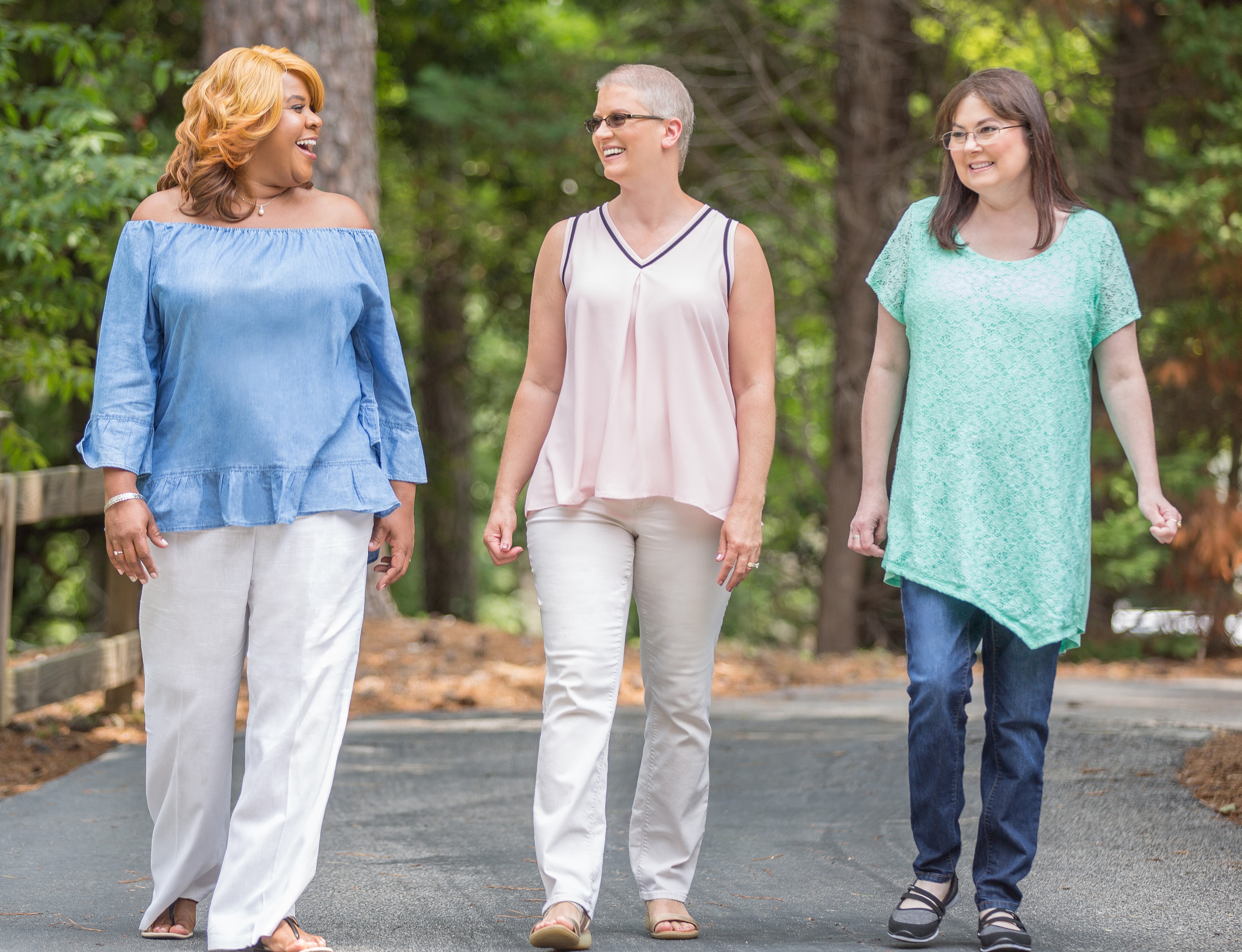 three women walking side by side