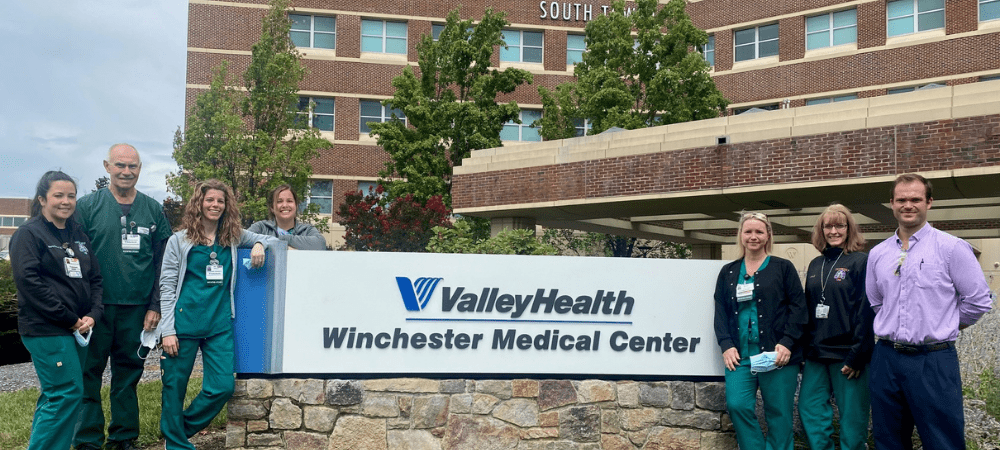 Hospital staffs in front of winchester
