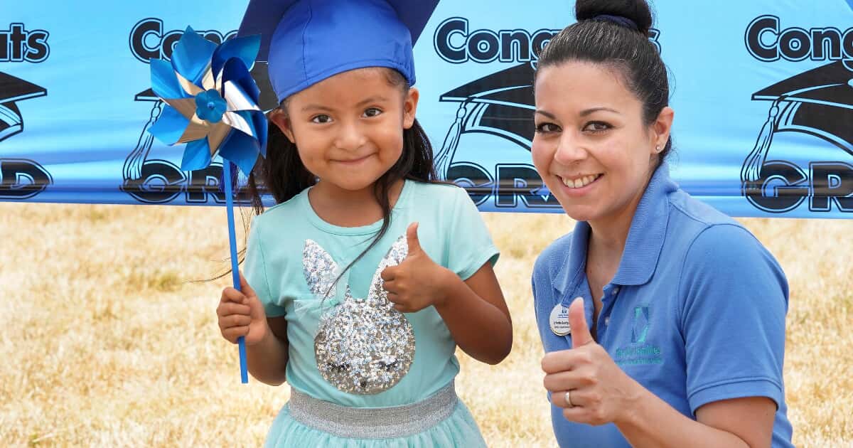 a kid posing with a staff