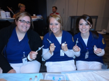 women holding needles