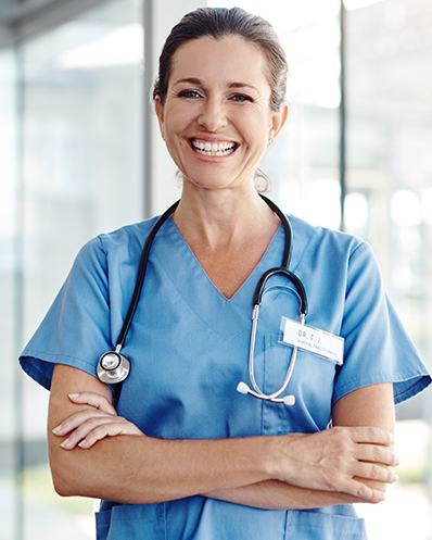 nurse smiling with her arms crossed