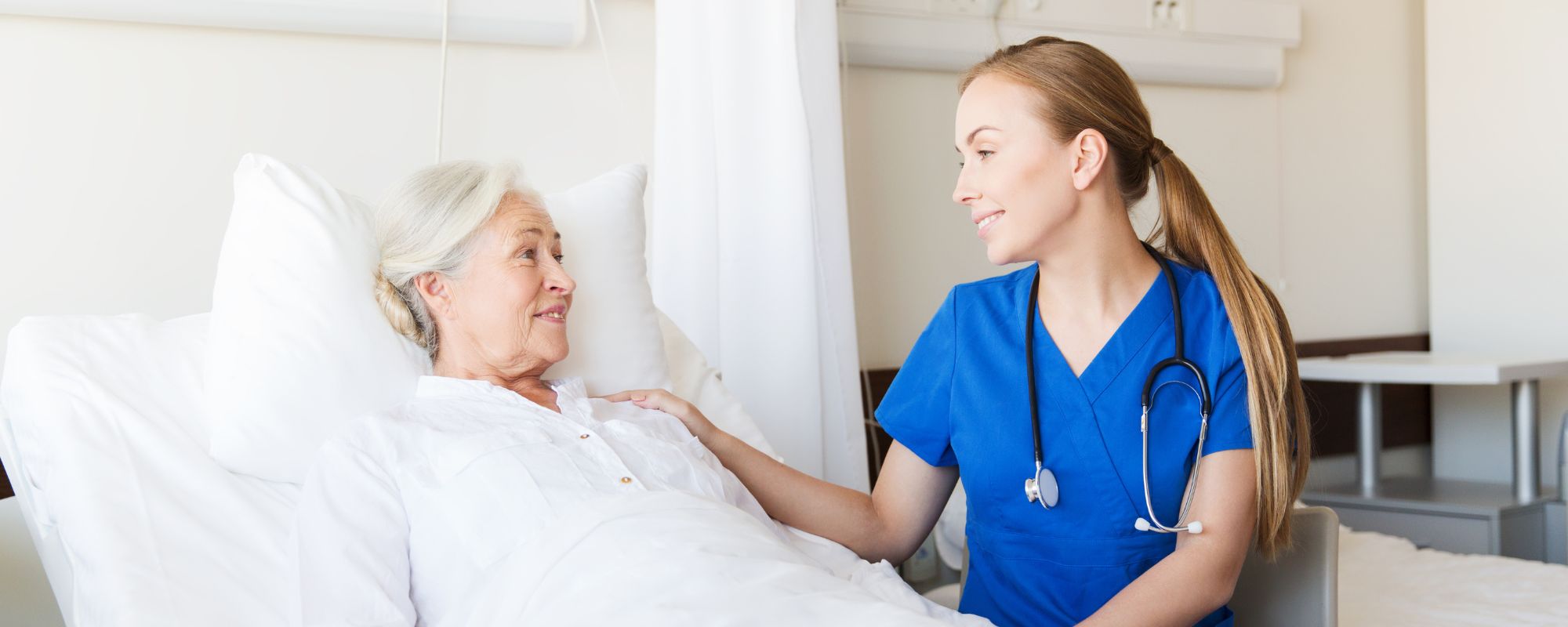 Female nurse holding a young boy