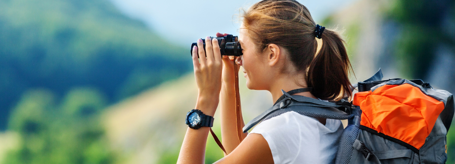woman looking with binoculars