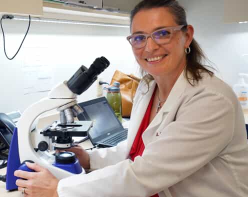 woman at a microscope